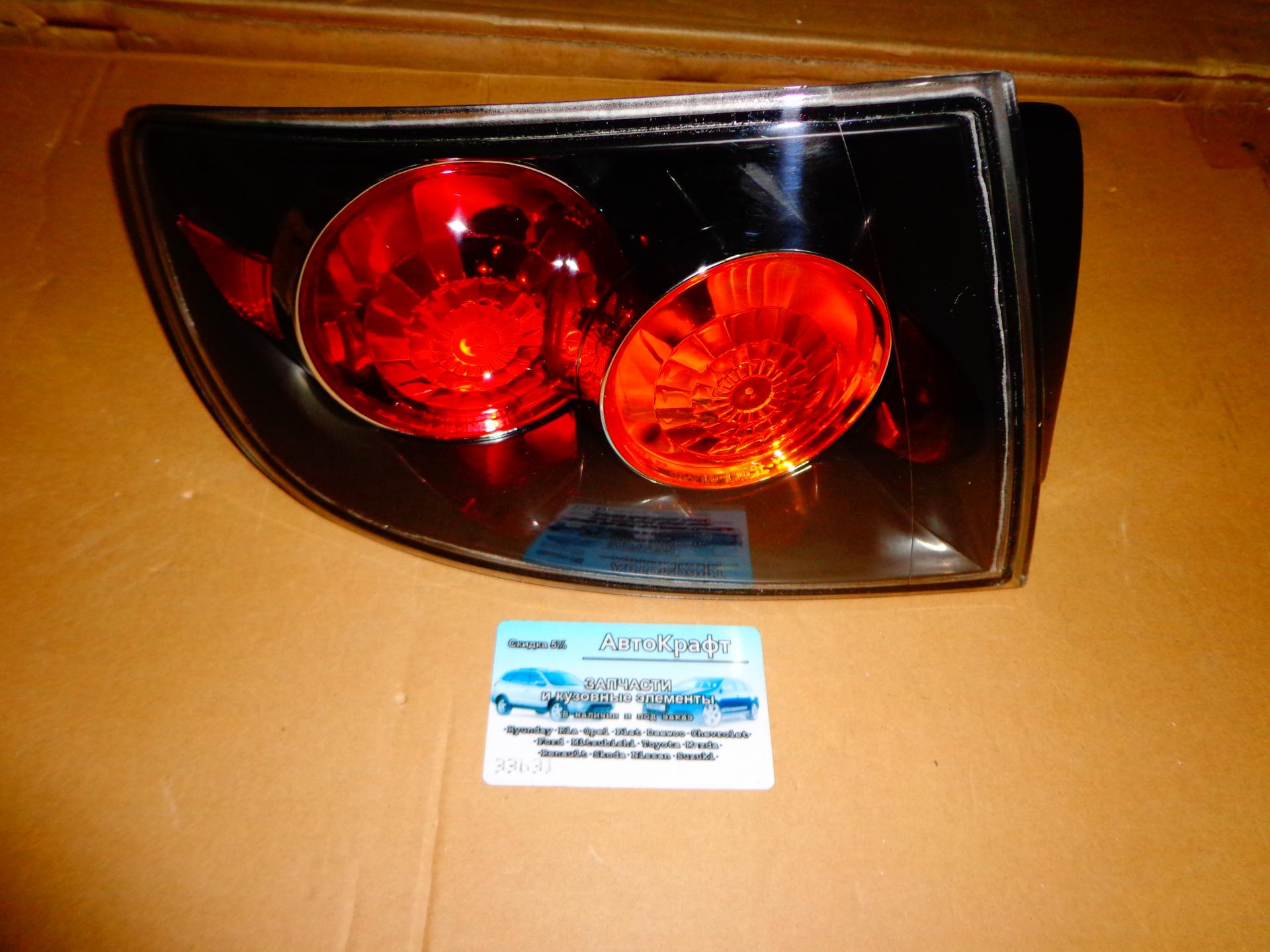 Фонарь наружний левый Mazda 3 SDN 2003-