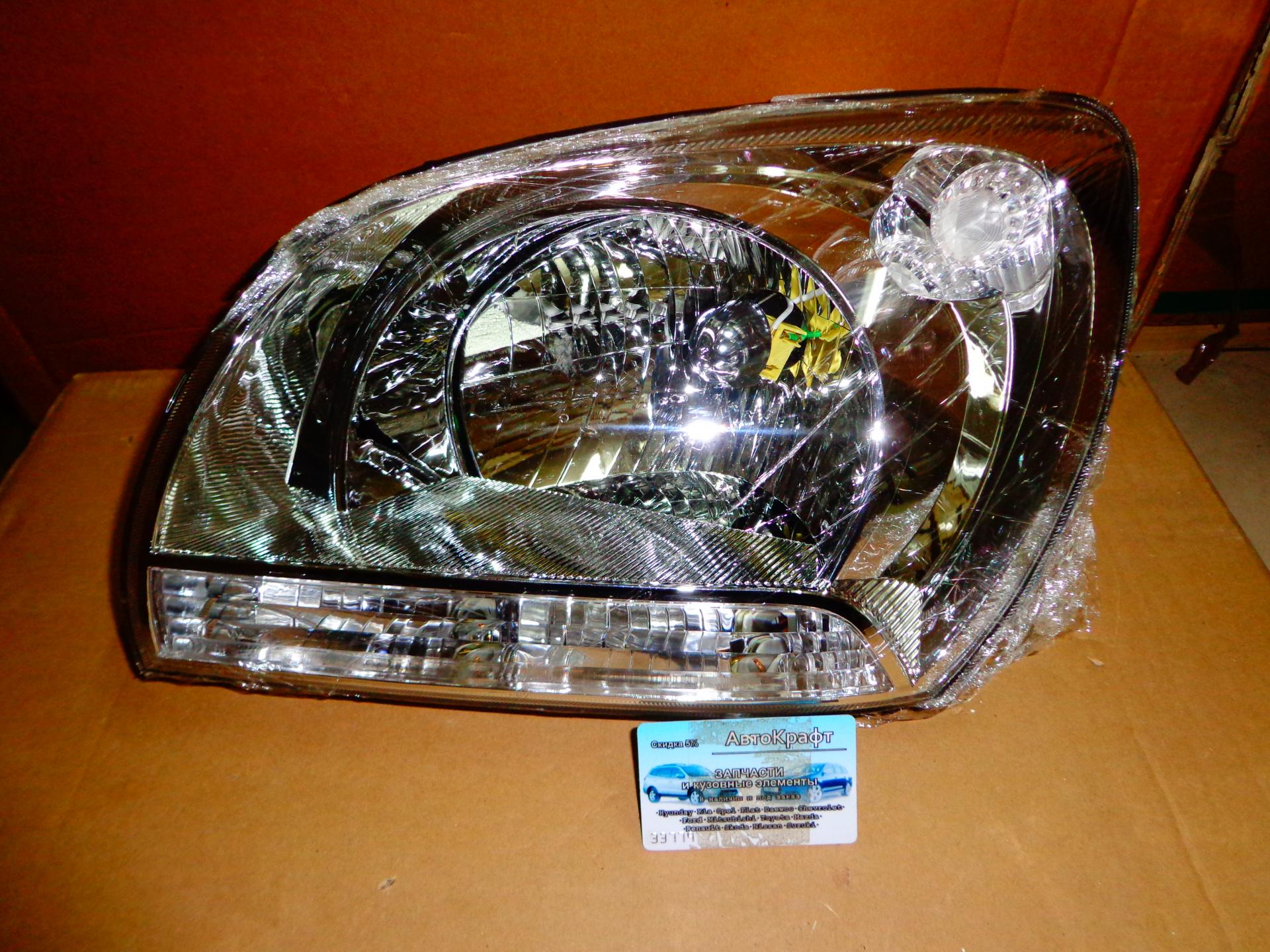 Фара левая Kia Sportage
